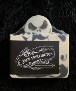 White and black swirled Halloween soap bar with Jack Skellington embed atop.